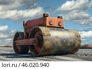 Old road roller compacting asphalt on a sunny day. Стоковое AI-изображение, AI-художник Иван Рябоконь / Фотобанк Лори