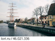 Klaipeda, Lithuania, February 2019, City street cloudy rainy day, little town. Редакционное фото, фотограф Spirit River / Фотобанк Лори