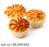 Delicious coconut macaroons with a golden brown crust arranged on a white surface for an enticing display. Стоковое фото, фотограф Сергей Толмачёв / Фотобанк Лори