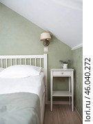 A bed with white sheets and a vintage Provence-style bedside table in a hotel room or a home bedroom. Space for the text. Enjoying the morning concept. Стоковое фото, фотограф Photojuli / Фотобанк Лори