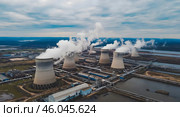 View on cooling towers of nuclear power plant thermal power station in which heat source is nuclear reactor. Стоковое AI-изображение, AI-художник Ирина Старикова / Фотобанк Лори