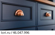 Front kitchen wooden frame cabinet door and drawers. Closeup Dark Blue Kitchen. Wooden cabinet door, brass door handles, furniture base set. Trendy interior units. Home improvement concept. Samples. Стоковое AI-видео, аниматор Марина Демидюк / Фотобанк Лори