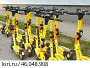 Moscow, Russia - June 6. 2023 Short-term rental service for electric scooters Yandex Go. Редакционное фото, фотограф Володина Ольга / Фотобанк Лори
