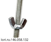 Long metal screw and a U-shaped nut isolated on a white background. Стоковое фото, фотограф Елена  Попкова / Фотобанк Лори