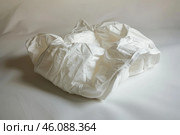 White adult diaper lying on a white background. Стоковое AI-изображение, AI-художник Иван Рябоконь / Фотобанк Лори