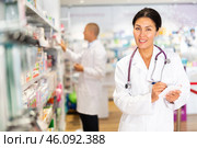 Oriental female druggist in chemist shop. Стоковое фото, фотограф Яков Филимонов / Фотобанк Лори