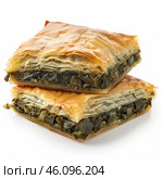 Delicious spanakopita, savory greek spinach pie layered with flaky phyllo dough, isolated on white. Стоковое AI-изображение, AI-художник Иван Рябоконь / Фотобанк Лори