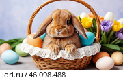 little lop-eared rabbit is the symbol of Easter. Rabbit in a basket with coloured Easter eggs. Easter banner, Easter wallpaper. Easter card. Стоковое AI-изображение, AI-художник Оксана Медведева / Фотобанк Лори