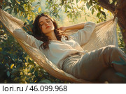 Young woman in modest clothing relaxes, half-lying in hammock in shade of green garden. Simple, slow life. Стоковое AI-изображение, AI-художник Алла Чесноковва / Фотобанк Лори