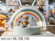 Beautiful colorful showcase of a children's store with a rainbow and a teddy bear. The concept of shopping and shopping for children's goods. Стоковое AI-изображение, AI-художник Photojuli / Фотобанк Лори