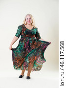 Plus size fashion model, fat woman on beige background, overweight female body. Стоковое фото, фотограф Станислав Тарко / Фотобанк Лори