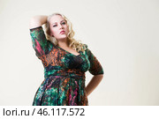 Plus size fashion model, fat woman on beige background, overweight female body. Стоковое фото, фотограф Станислав Тарко / Фотобанк Лори