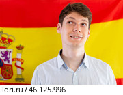 Young guy posing in front of flag of Spain. Стоковое фото, фотограф Татьяна Яцевич / Фотобанк Лори