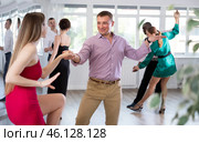 Woman dances incendiary boogie woogie with man partner during choreography lesson. Стоковое фото, фотограф Яков Филимонов / Фотобанк Лори
