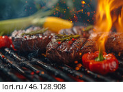 Steaks sizzle on a hot grill as flames rise, complemented by vibrant peppers and herbs. The warm glow of dusk enhances the inviting barbecue atmosphere. Стоковое AI-изображение, AI-художник Sergey Grishin / Фотобанк Лори