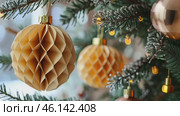 Honeycomb Paper Ornaments Hanging on a Christmas Tree. Paper Christmas Handmade foldable decor. Winter Creativity Crafts. Trendy Eco DIY. Modern Decoration. Boho Design. Structural 3d Origami Toy. Стоковое AI-видео, аниматор Марина Демидюк / Фотобанк Лори