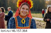 A banner for the Carnival holiday with space to copy. A girl in a traditional costume in close-up at Russian festivities. Стоковое AI-изображение, AI-художник Photojuli / Фотобанк Лори