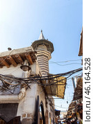Mosque minaret and crazy tangle of electrical wires in the old city of Damascus. Republic of Syria. Стоковое фото, фотограф Евгений Ткачёв / Фотобанк Лори