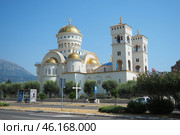 Bar, Montenegro 07.20.24: The Church of St. Jovan Vladimir is a Serbian Orthodox Church, located in the city center, near the coastline. A majestic snow-white building with gilded domes and bells. (2024 год). Редакционное фото, фотограф Юлия Петровская / Фотобанк Лори