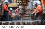Drilling rig boring into earth with construction workers in background. Стоковое AI-изображение, AI-художник Юрий Поздников / Фотобанк Лори