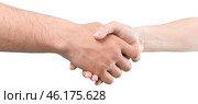Handshake between diverse individuals symbolizes unity and collaboration in a professional setting. Стоковое фото, фотограф Сергей Толмачёв / Фотобанк Лори