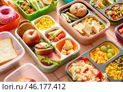 Many lunchboxes with different delicious food on pink tile background. Стоковое фото, фотограф Pixel_shot / Фотобанк Лори