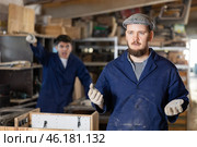 Disgruntled furniture factory owner yells at careless worker. Стоковое фото, фотограф Яков Филимонов / Фотобанк Лори