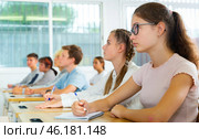 Students listening task for exam in classroom. Стоковое фото, фотограф Яков Филимонов / Фотобанк Лори