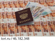 Денежный фон из пятитысячных купюр, купюры 50, 100, 500 и 1000 рублей, российский паспорт / A monetary fund of five thousand banknotes, 50, 100, 500 and 1000 rubles, a Russian passport. Стоковое фото, фотограф Петроченко Мария Петровна / Фотобанк Лори