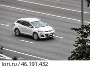 Mazda CX-7 car driving in city with motion blur, view from above and front side. Редакционное фото, фотограф Константин Григорьев / Фотобанк Лори