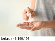 Woman using antibacterial hand sanitizer, closeup. Стоковое фото, фотограф Pixel_shot / Фотобанк Лори