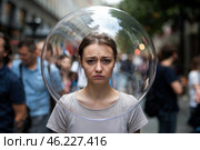 Woman with allergies on a city street with a transparent spherical cap over her head. Стоковое AI-изображение, AI-художник Дмитрий Киселёв / Фотобанк Лори