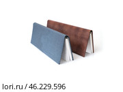 Two leather cover diaries isolated on white background. Стоковое фото, фотограф Елена  Попкова / Фотобанк Лори