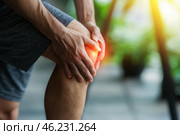 Knee pain, joint inflammation, arthritis and degenerative changes, man suffering from leg ache and doing self-massage. Стоковое AI-изображение, AI-художник Станислав Тарко / Фотобанк Лори