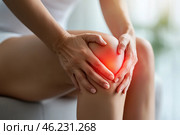 Knee pain, joint inflammation, arthritis and degenerative changes, woman suffering from leg ache and doing self-massage. Стоковое AI-изображение, AI-художник Станислав Тарко / Фотобанк Лори