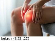 Knee pain, joint inflammation, arthritis and degenerative changes, woman suffering from leg ache and doing self-massage. Стоковое AI-изображение, AI-художник Станислав Тарко / Фотобанк Лори