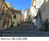 Scalea, Italy. November 11, 2024. Calabria. Scalea old city, historical center.View of the Piazza Maggiore de Palma.Stairs Krocheviya leading to residential buildings. Sunny day. Редакционное фото, фотограф Мария Фетисова / Фотобанк Лори
