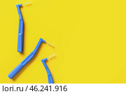Toothbrushes for dental braces and floss on color background. Стоковое фото, фотограф Pixel_shot / Фотобанк Лори