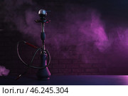 Hookah with fume on dark background. Стоковое фото, фотограф Pixel_shot / Фотобанк Лори