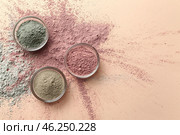 Cosmetic clays in bowls on color background. Стоковое фото, фотограф Pixel_shot / Фотобанк Лори