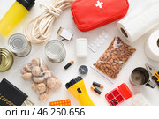 Necessities for emergency bag on white table. Стоковое фото, фотограф Pixel_shot / Фотобанк Лори