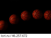 Stroboscopic photo of moving ball on dark background. Стоковое фото, фотограф Pixel_shot / Фотобанк Лори