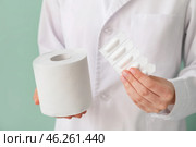 Doctor with toilet paper and hemorrhoidal suppositories, closeup. Стоковое фото, фотограф Pixel_shot / Фотобанк Лори