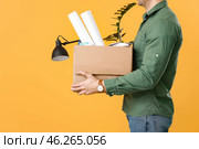 Fired man with personal things on color background. Стоковое фото, фотограф Pixel_shot / Фотобанк Лори