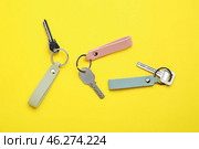 Keys with leather keychains on color background. Стоковое фото, фотограф Pixel_shot / Фотобанк Лори