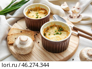 Ramekins with tasty julienne and ingredients on light background. Стоковое фото, фотограф Pixel_shot / Фотобанк Лори