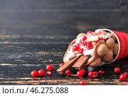 Cup with delicious sweet bubble waffle on dark wooden background. Стоковое фото, фотограф Pixel_shot / Фотобанк Лори