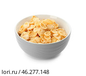 Bowl with healthy cornflakes on white background. Стоковое фото, фотограф Pixel_shot / Фотобанк Лори