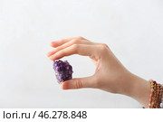 Female hand with beautiful amethyst on light background. Стоковое фото, фотограф Pixel_shot / Фотобанк Лори