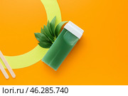 Liposoluble wax cartridge on color background. Стоковое фото, фотограф Pixel_shot / Фотобанк Лори